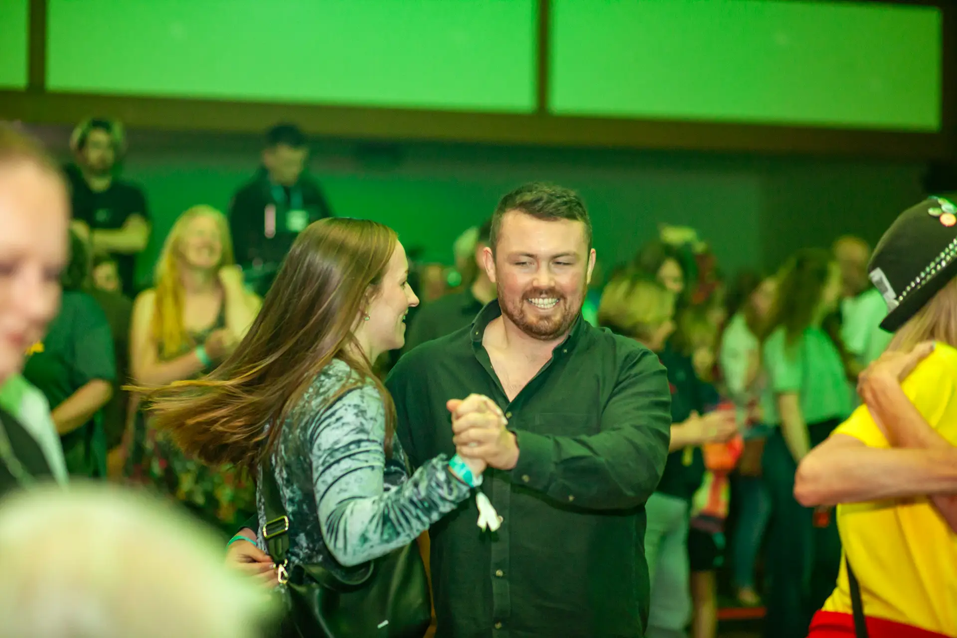 Couple dancing together in the crowd