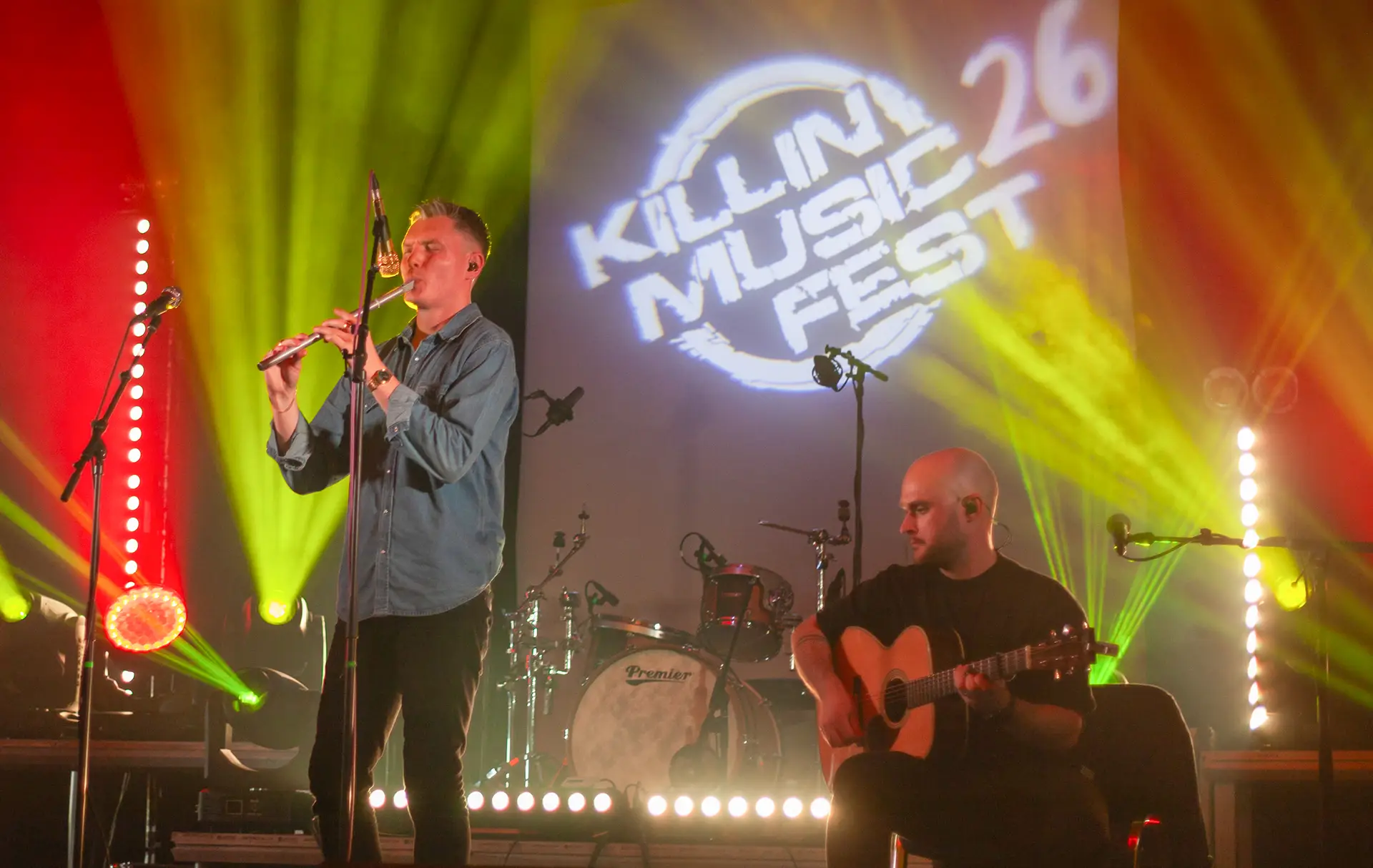 Musicians performing under stage lights at Killin Music Fest