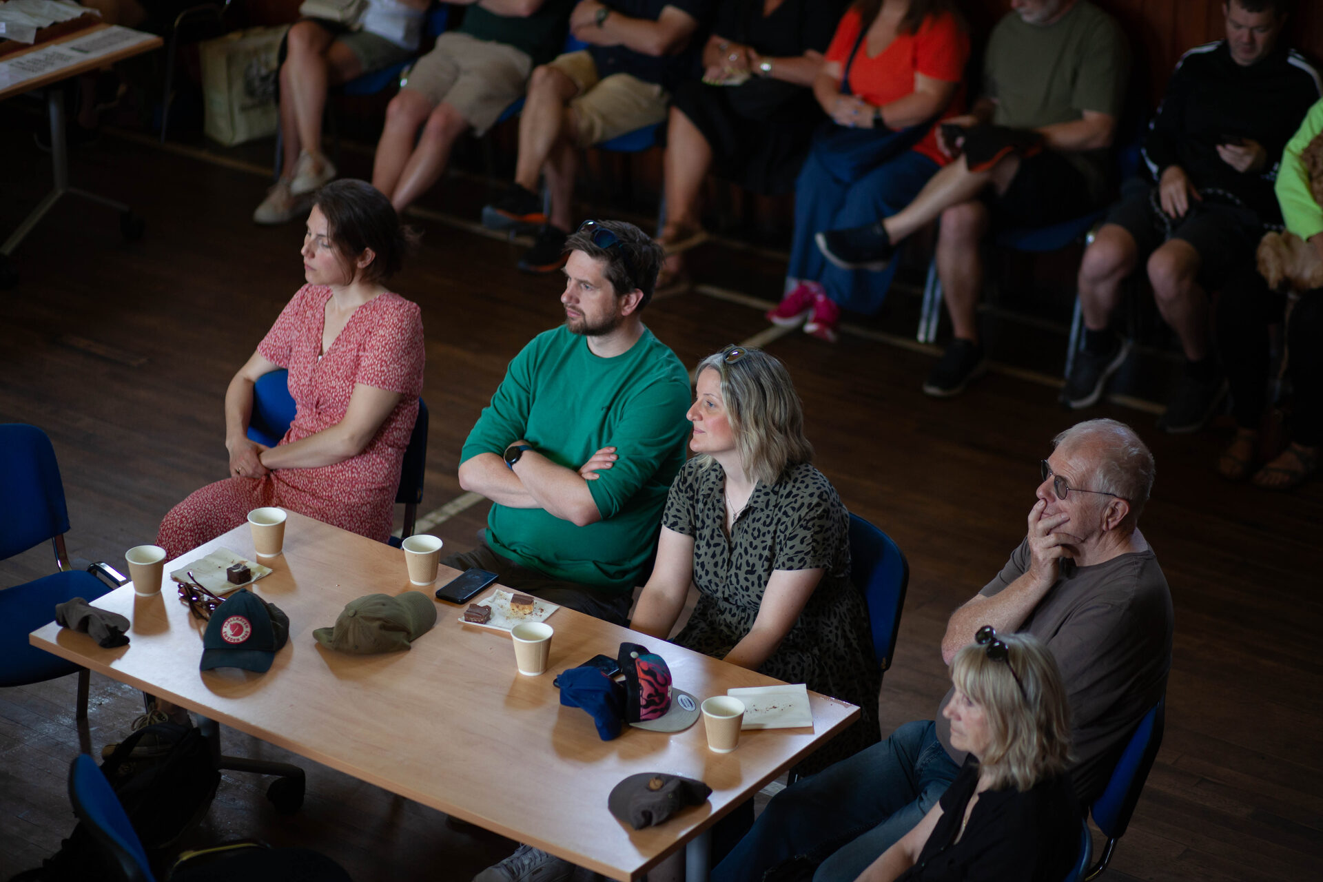 Audience seated at the tables during the Sunday community day