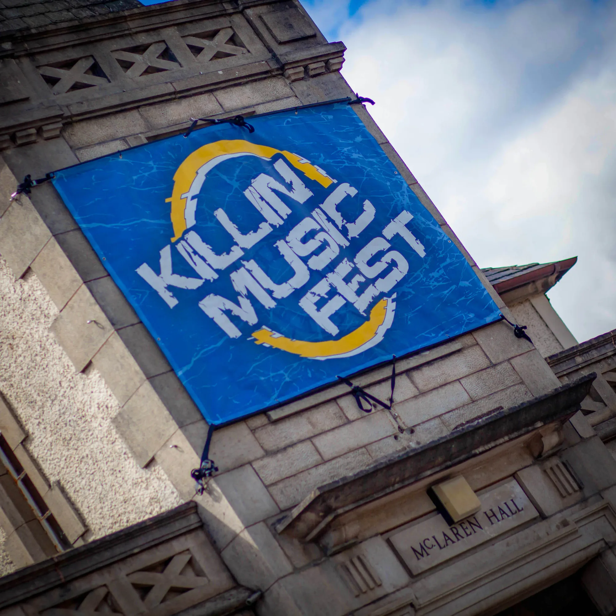 The Killin Music Fest banner strapped to the McLaren Hall turret