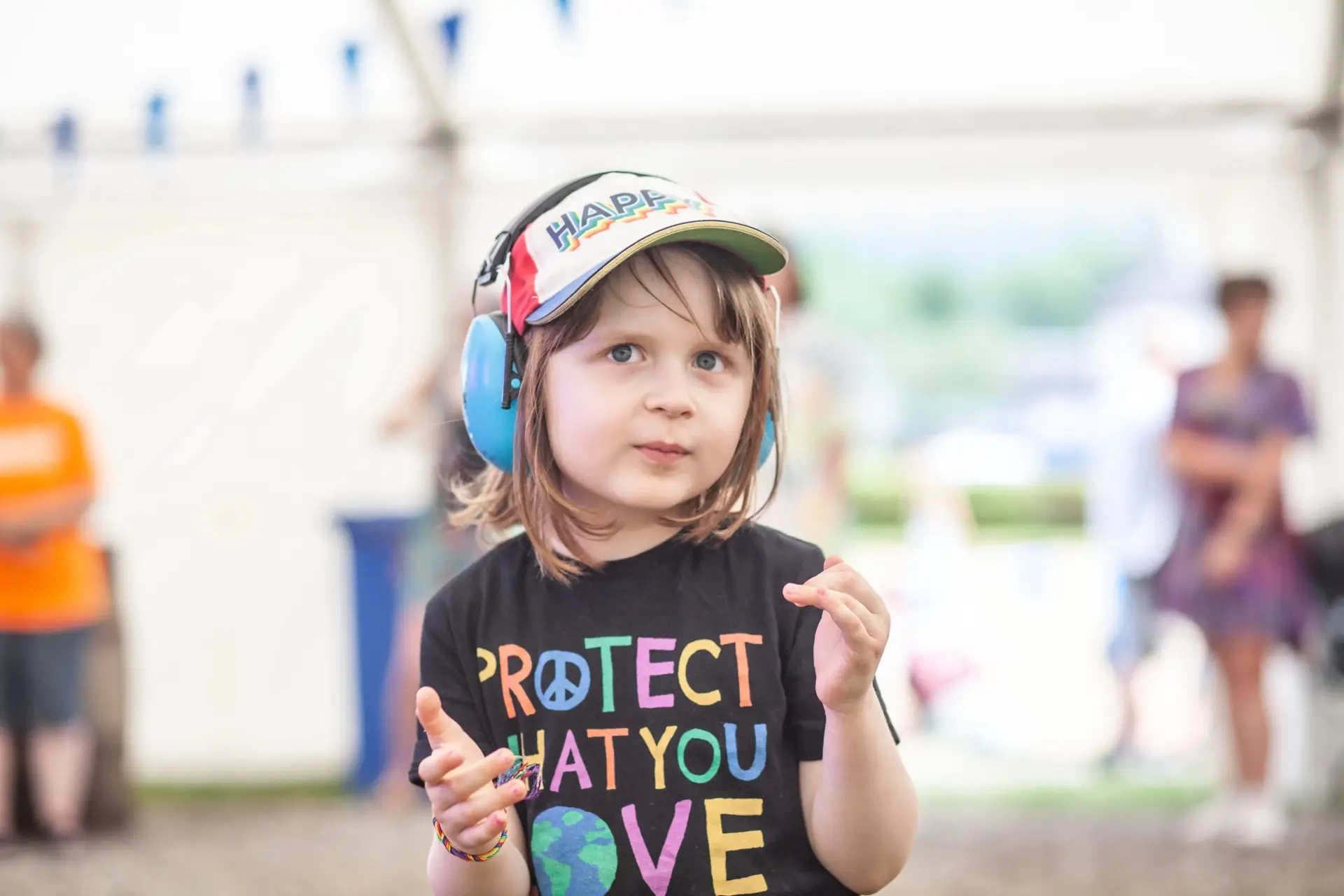 Young festival-goer with ear defenders